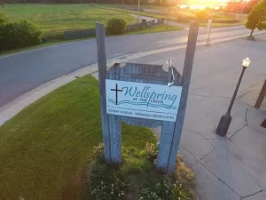 Wellspring at the Cross sign